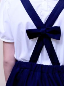 Chân váy yếm bé gái 2 túi bên nơ sau đồng phục học sinh nữ